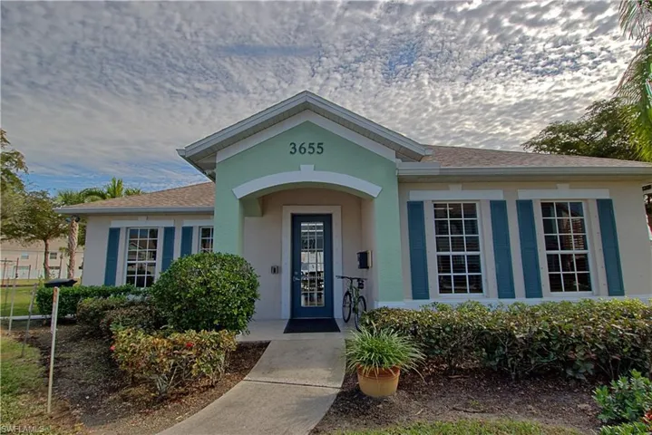 Clubhouse which features a community room, kitchen, and fitness center.
