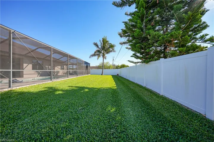 View of yard featuring a lanai