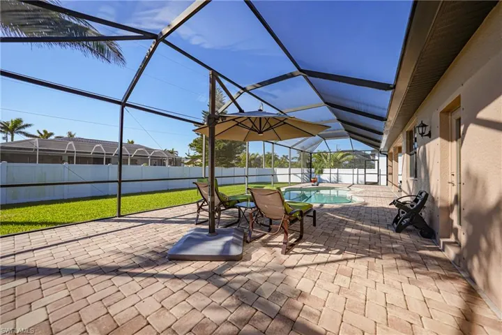 View of patio / terrace with a fenced in pool and glass enclosure