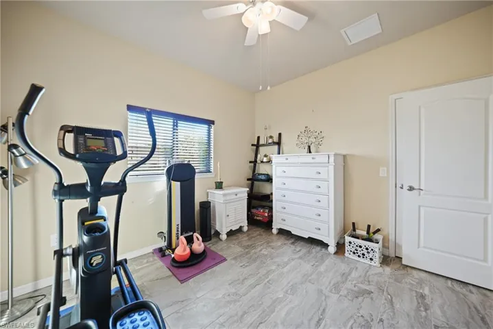 Exercise area featuring ceiling fan