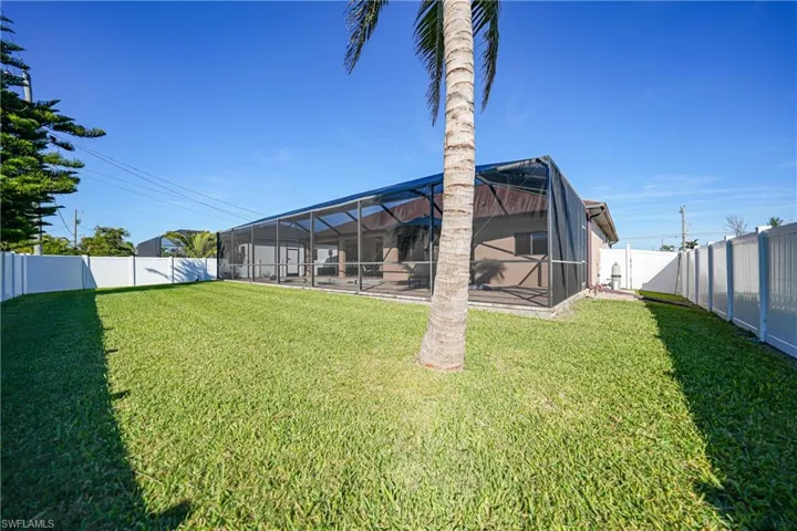 View of yard featuring a lanai