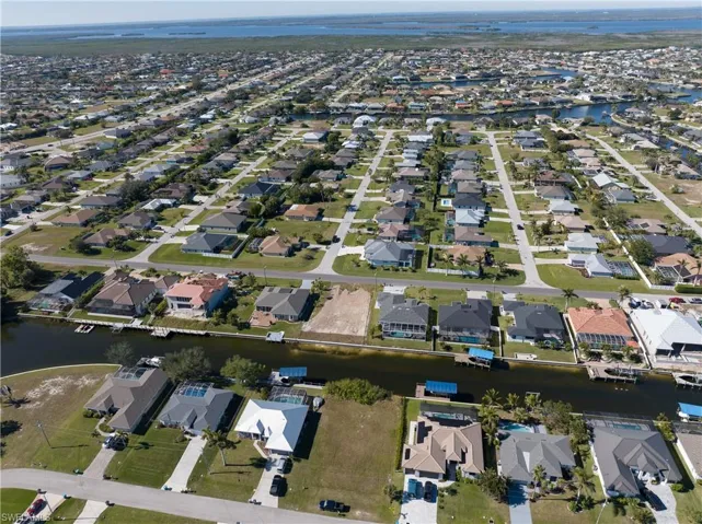 View of property location featuring nearby suburban area and a large body of water