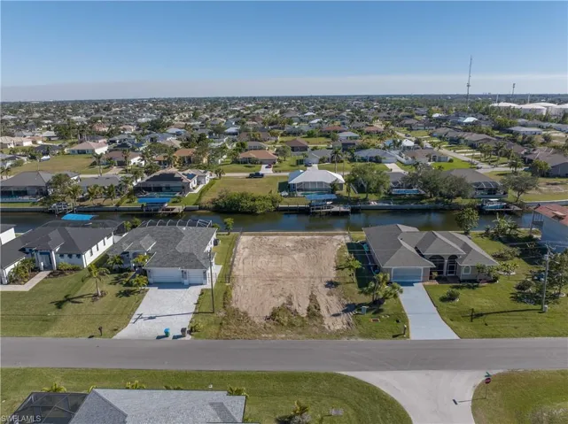 Aerial perspective of suburban area with a large body of water