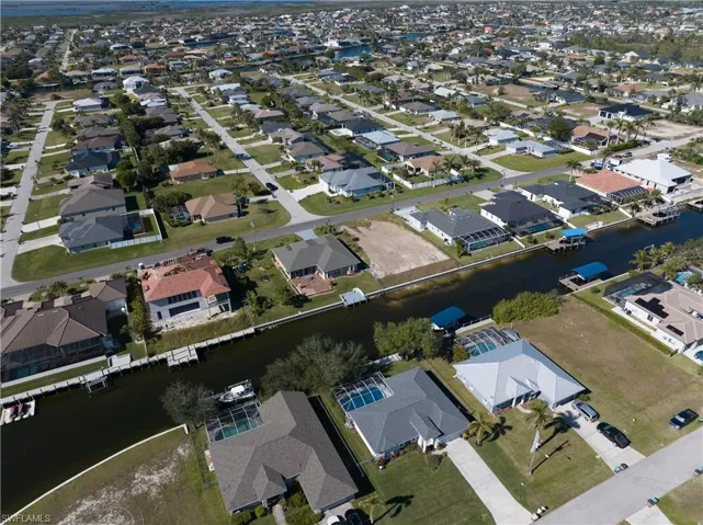 View of property location with nearby suburban area and a large body of water