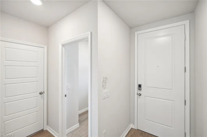 Entryway with hardwood / wood-style flooring