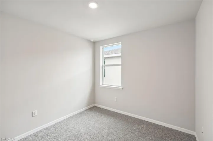 Unfurnished room with carpet