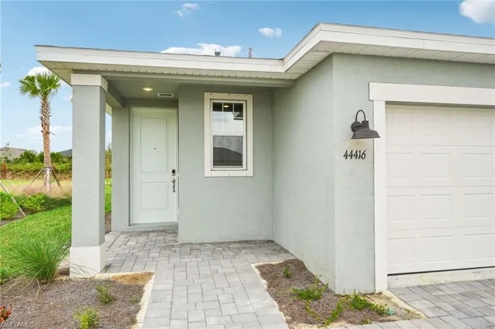 Entrance to property with a garage