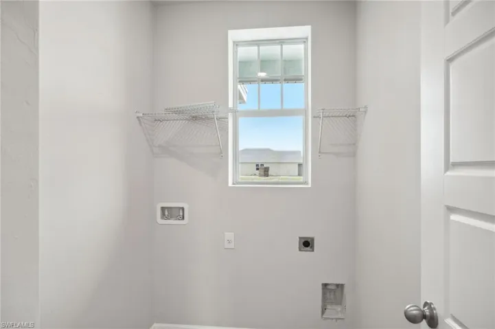 Laundry room featuring washer hookup and hookup for an electric dryer