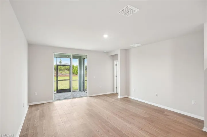 Empty room with light wood-type flooring