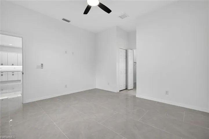 Unfurnished bedroom featuring a closet and ceiling fan