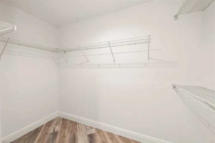 The master features two large closets. This is the walk in closet on one side. The other side is a standard with sliding doors but is also oversized.