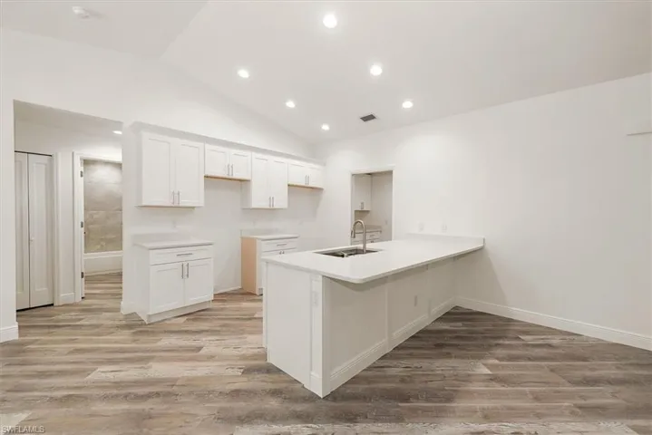 Open kitchen with bar seating