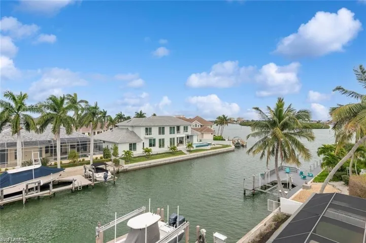 View of dock with a water view and boat lift