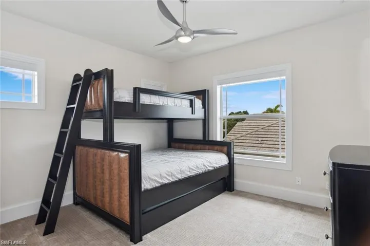 #3  bedroom upper level featuring ceiling fan and baseboards