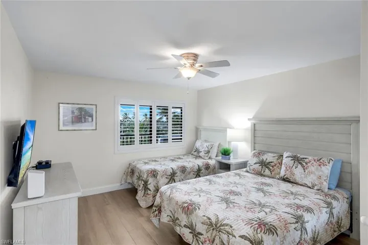 Bedroom featuring hardwood / wood-style flooring and a ceiling fan