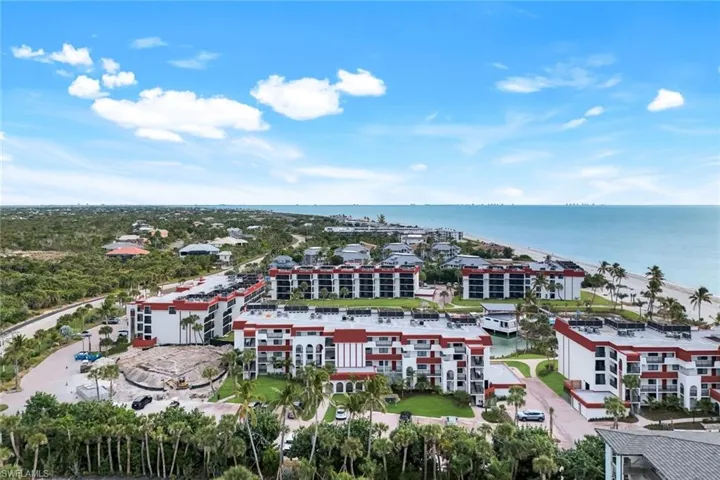 Aerial view of apartment complex / building and a large body of water
