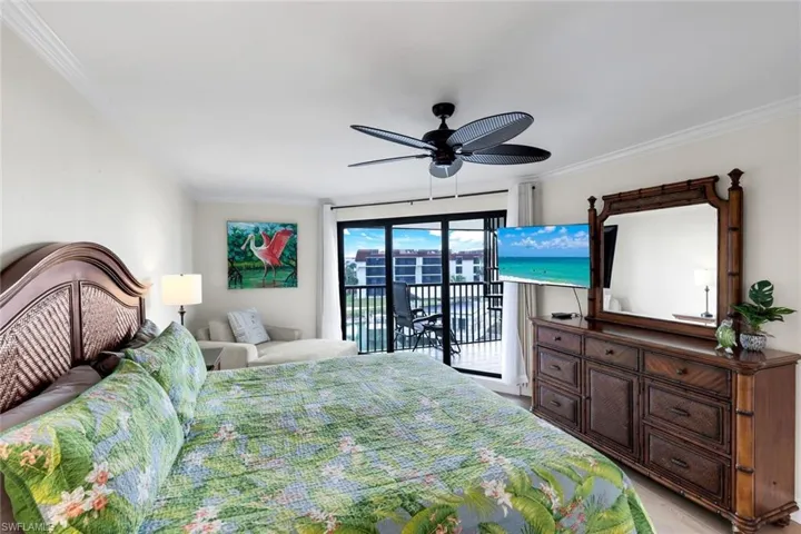 Bedroom with crown molding, access to outside, and ceiling fan