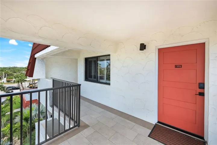 Entrance to property featuring stucco siding