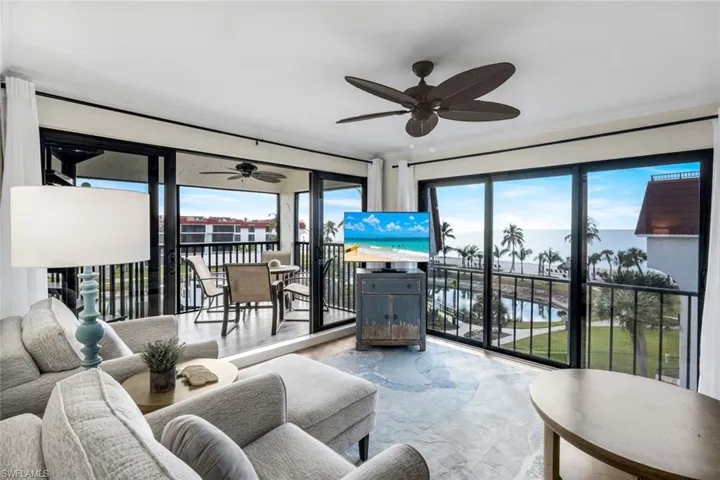 Living area with healthy amount of natural light and a ceiling fan