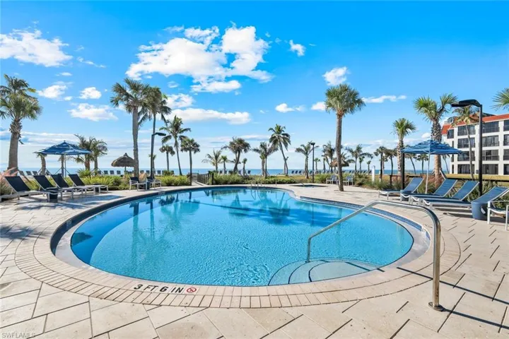 Community pool featuring a patio