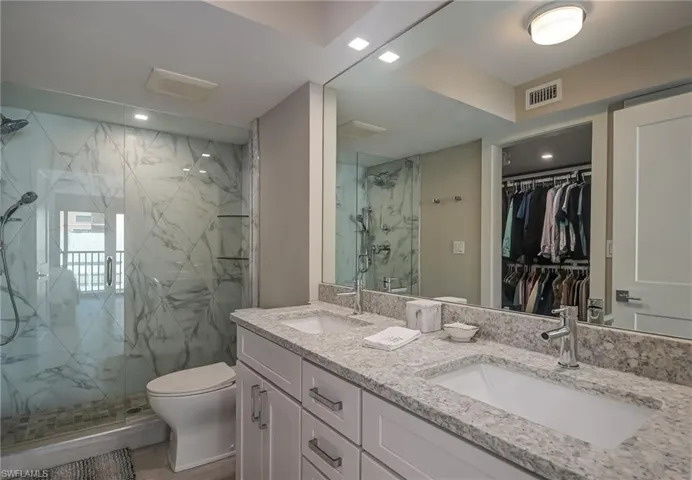 Double vanity with walk in closet