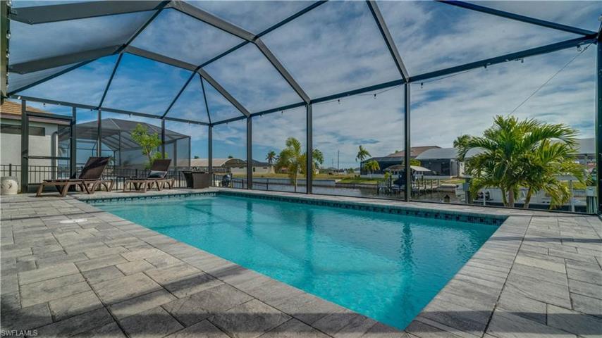 Gorgeous large pool with paver decking! Beautiful canal views!