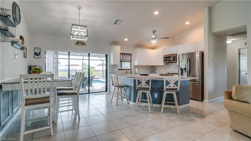 Dining area right off kitchen. Kitchen Island provides additional seating!