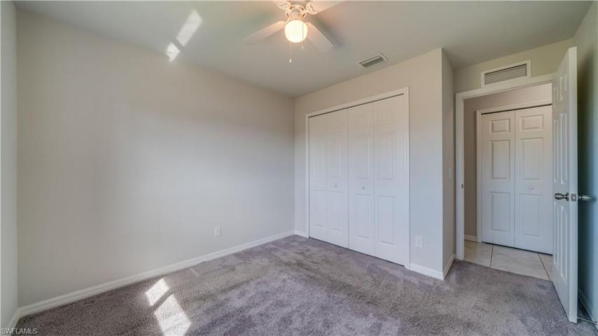 All three guest bedrooms have a large closet and lead out to a back hall with a large storage closet.