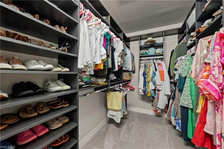 Master walk-in closet 1 with built-in shelves