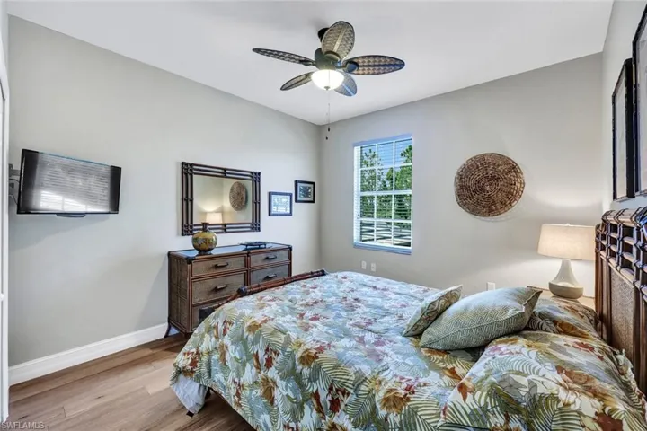 Bedroom with wood-type flooring and ceiling fan