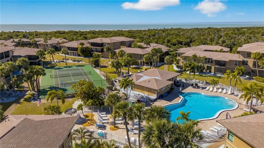 Aerial perspective of suburban area featuring a pool area