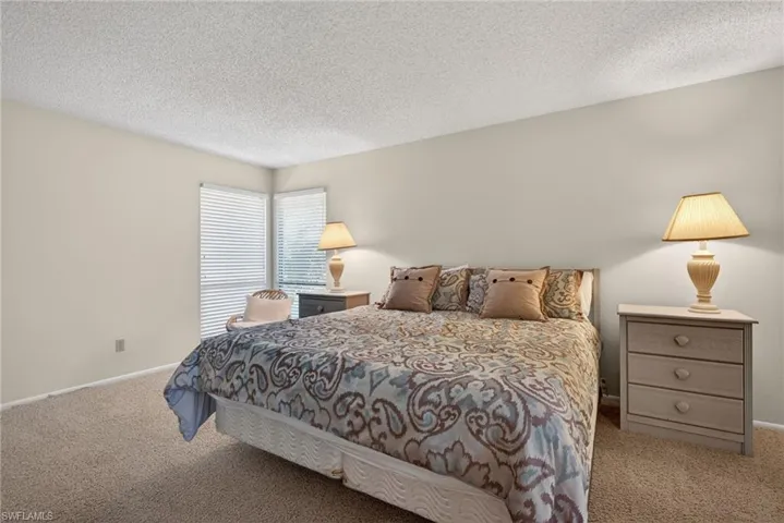Primary bedroom with a textured ceiling