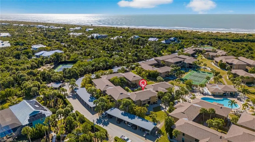 Aerial view of residential area featuring a large body of water