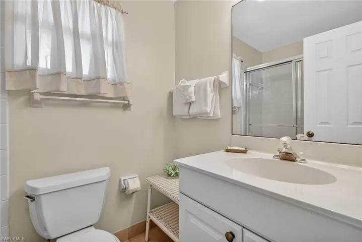 Primary bathroom featuring vanity and a shower stall