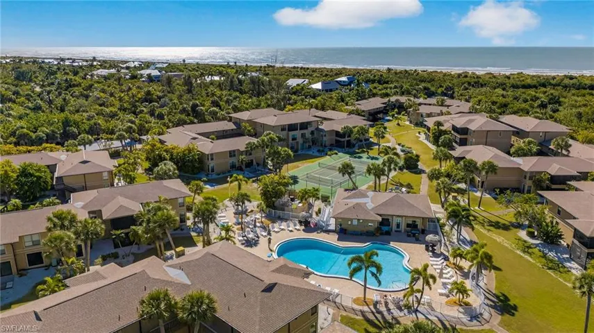 Aerial perspective of suburban area featuring a pool area