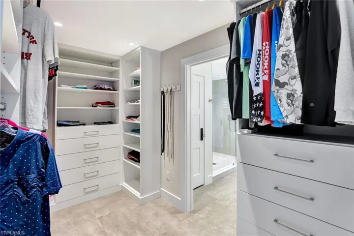 Spacious closet with light tile patterned flooring