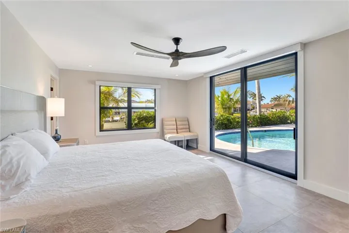 Bedroom featuring access to outside and ceiling fan