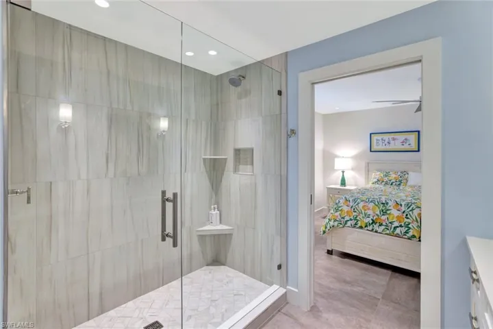 Bathroom featuring tile patterned floors and an enclosed shower