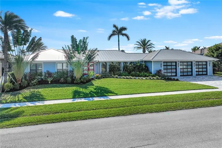 Single story home with a front yard