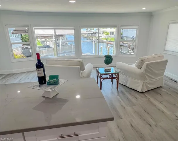 kitchen dining and living area with beautiful water views