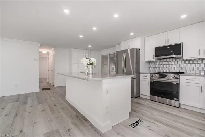 Updated kitchen with quartzite counters, new cabinets and appliances