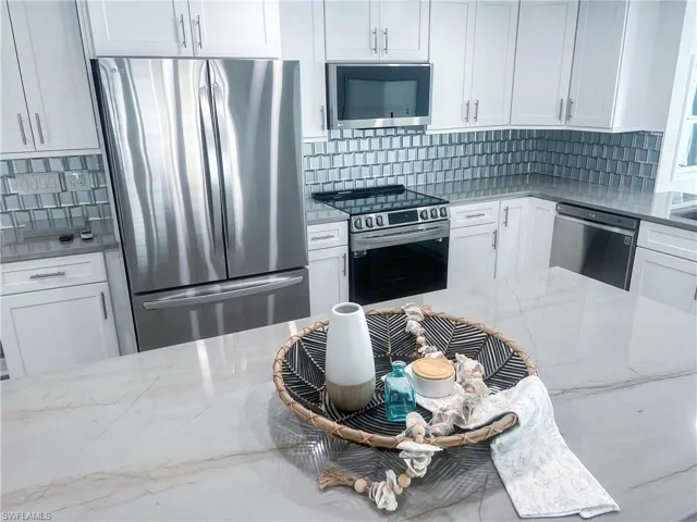 kitchen dining and living area with beautiful water views
