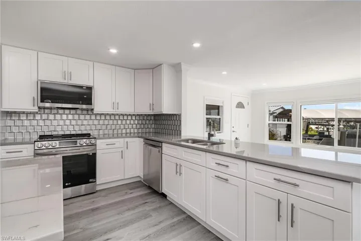 Updated kitchen with quartzite counters, new cabinets and appliances