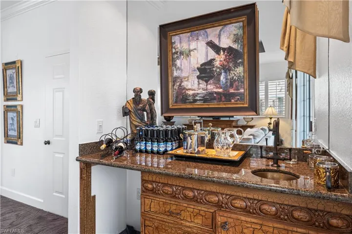 Beautiful wet bar, granite countertop, sink.