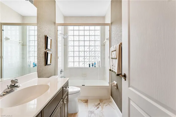 Lovely 2nd bath offers shower/tub combination. Natural light spills into this space.