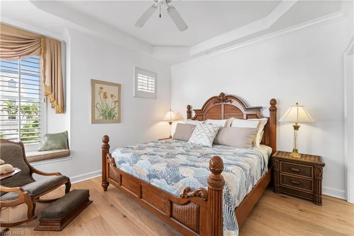 2nd bedroom has engineered wood flooring and a lovely window seating area.  Tray ceiling.