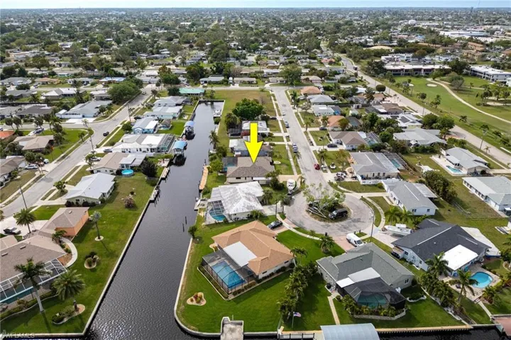 Aerial overview of property's location featuring nearby suburban area and a large body of water