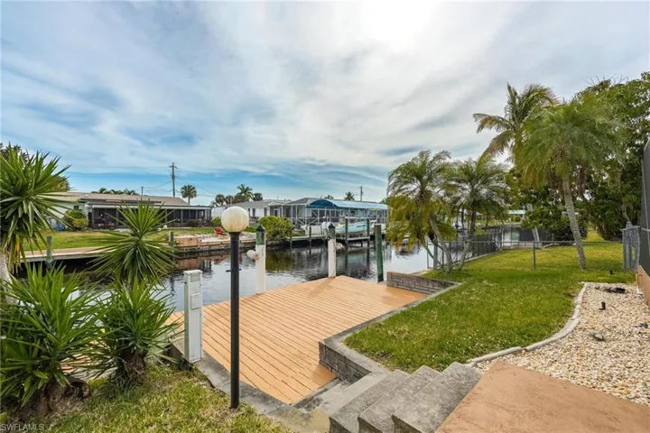 Dock featuring a water view and a residential view