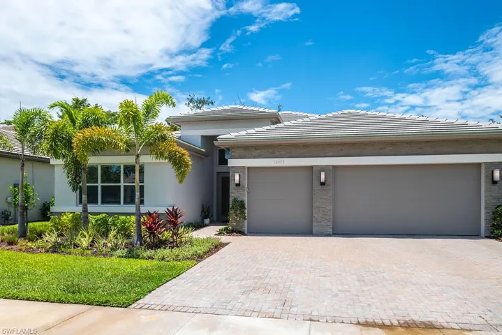 View of front of property with a garage