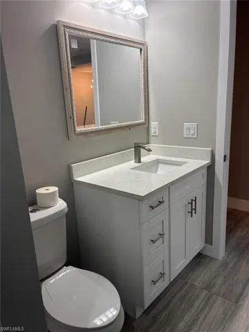 Bathroom featuring vanity and toilet